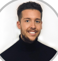 young man with a beard and a dark top