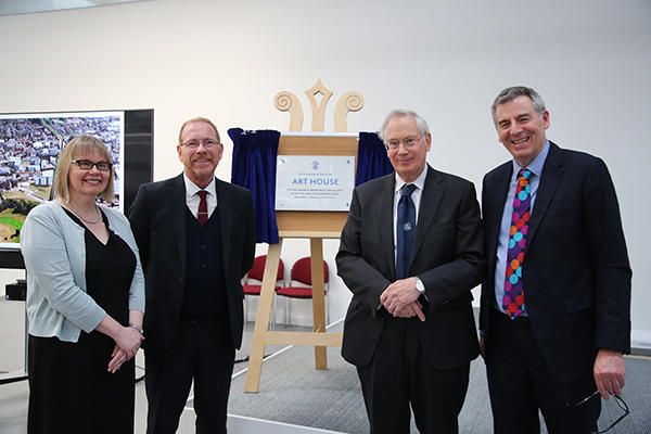 Sarah Greer, David Broster, The Duke of Gloucester and Professor David Green stand in a line in front of a stand