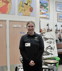 student in a black top in a classroom