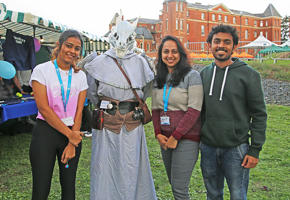 Four smiling students from the Manga society