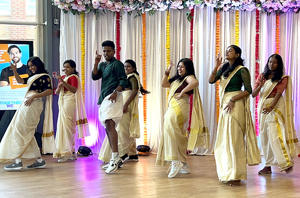 A group of students are dancing at Onam