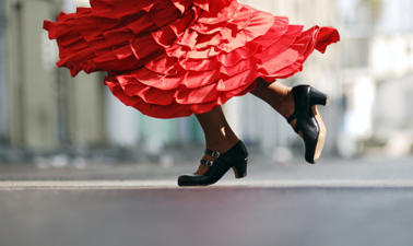 A close up shot of the bottom of a flamenco dancer's feet and her shoes