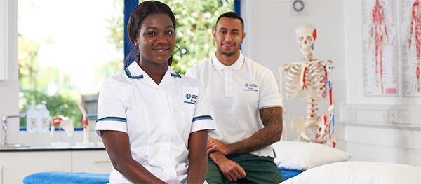 Two health specialist students in a clinical skills room