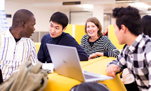 a group of students are sitting and chatting
