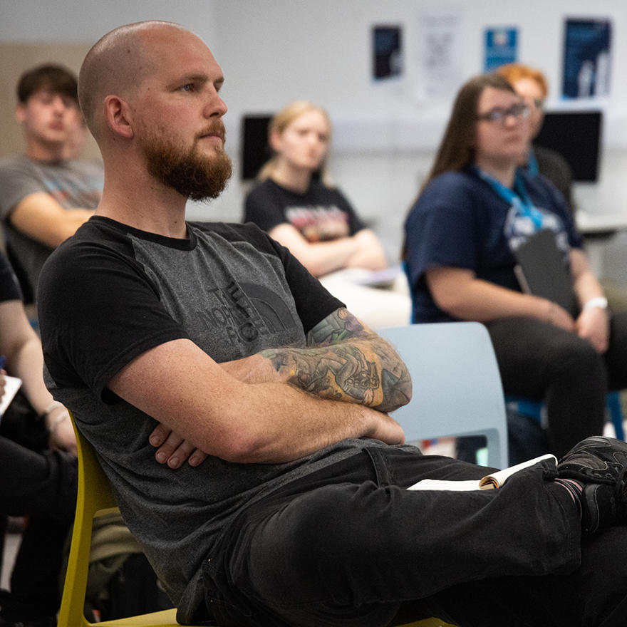 man sat on a chair