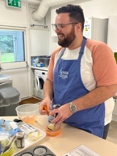University of Worcester logo on a light blue background