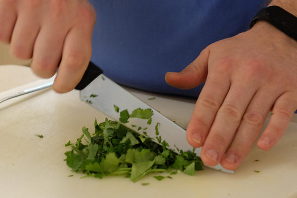 Student chopping coriander
