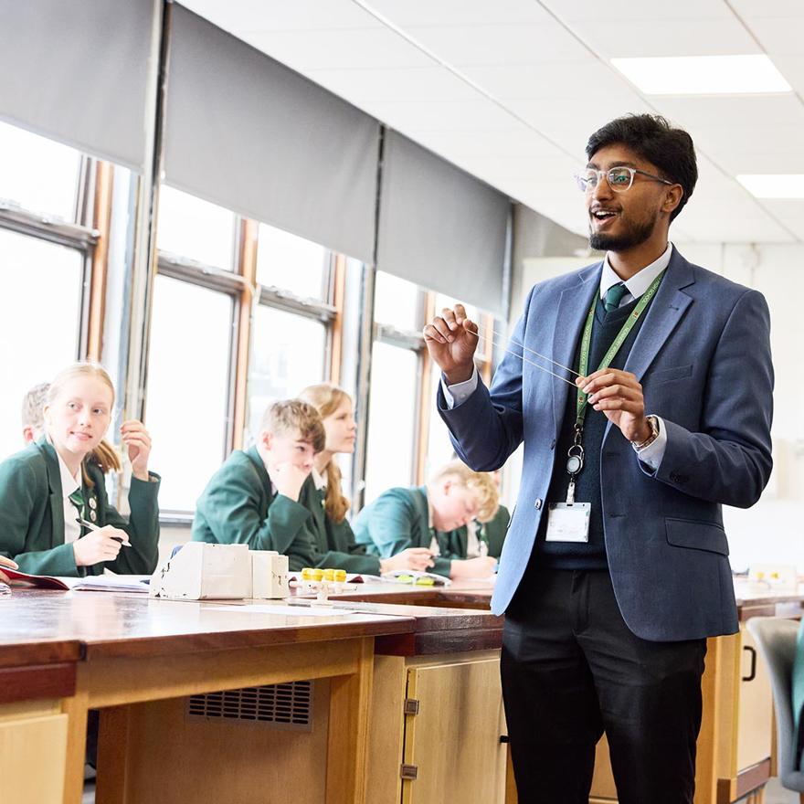 a teacher in a classroom teaching science