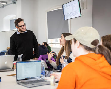 A lecturer is speaking to a student