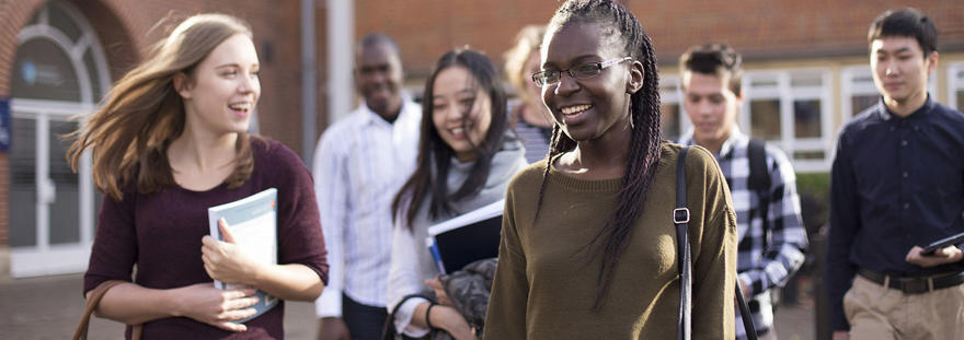 A group of students walking on the University of Worcester St John's campus