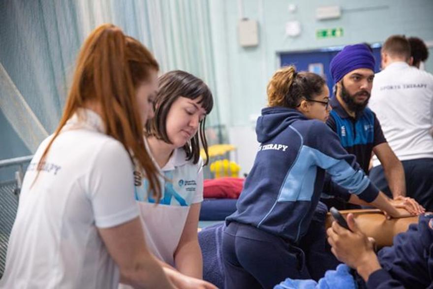 Students sports massaging patients