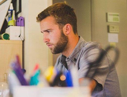 A man is working at a desk