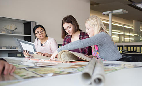 three students at a table