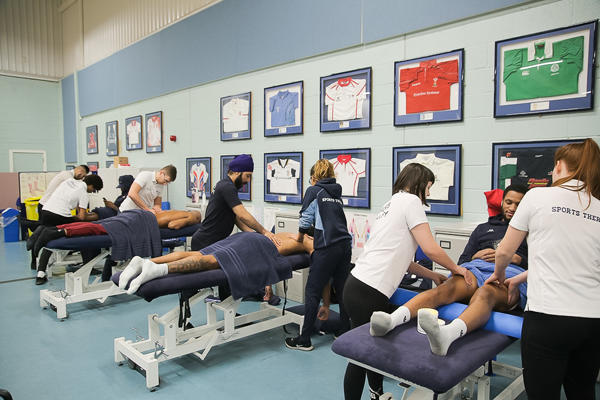 Sports Therapy degree students working at a clinic