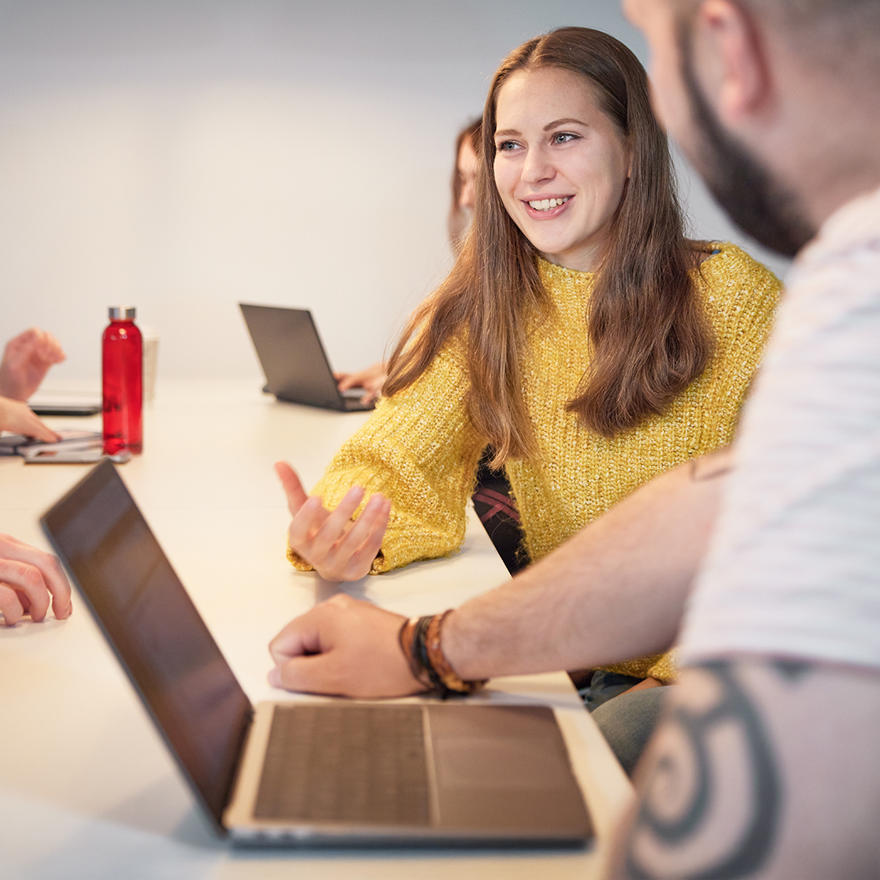 student talking within a group