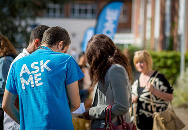 Student helping open day attendees