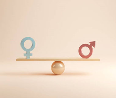 two gender symbols are on a seesaw