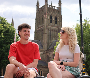 Two students in front of Worcester Cathedral