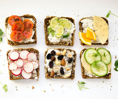 Six pieces of toast are covered with healthy vegetable toppings