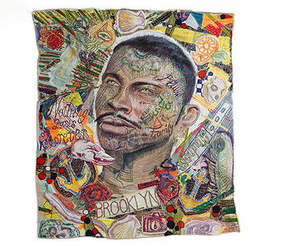 A close up image of one of Oly Bliss' tapestries of a tattooed man