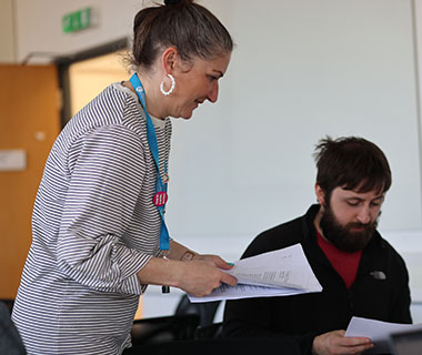 a lecturer is talking to a student