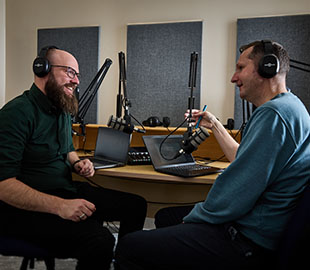 a man interviewing another man
