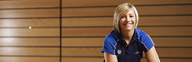 Blonde-haired woman in sports top
