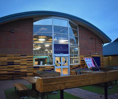 students' union from the outside with lights shining in the windows