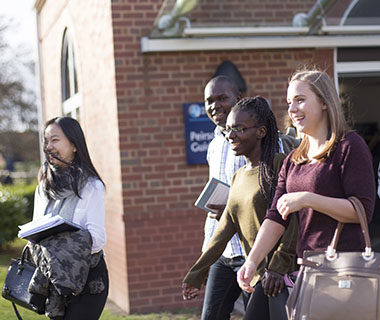 students-walking-and-laughing-on-campus-ui-card