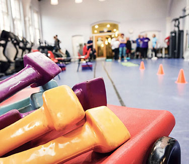 inside a sports hall with colourful equipment in the foreground