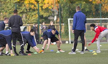 students carrying out an exercise drill outside