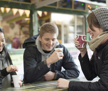 Students drinking coffee on campus