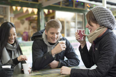 Students drinking coffee on campus